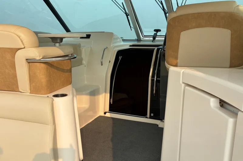 Slide: The Image of Interior of 2007 Tiara 3900 Sovran yacht, featuring beige seating and modern design. - 25