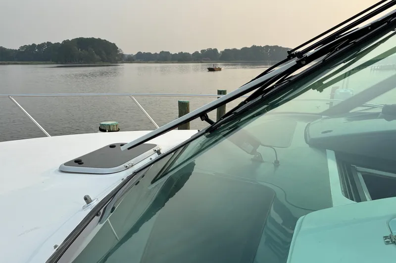 Slide: The Image of 2007 Tiara 3900 Sovran yacht on calm water with scenic background. - 18