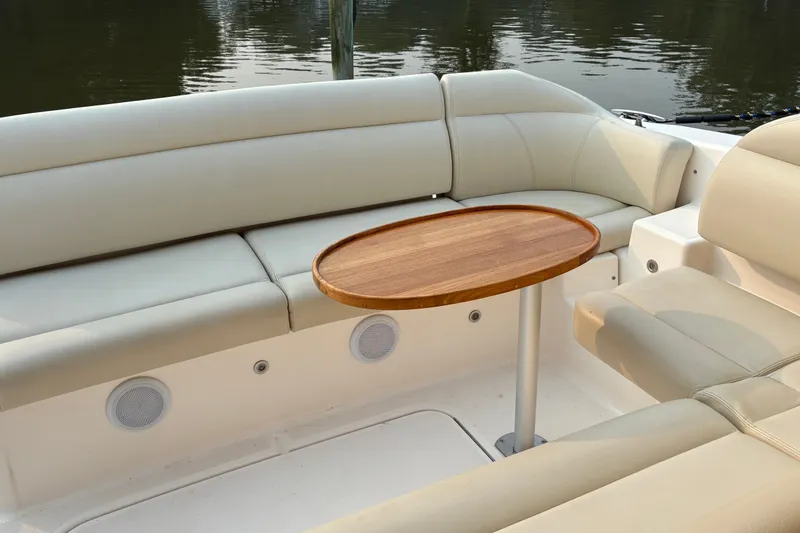 Slide: The Image of Luxurious seating area on a 2007 Tiara 3900 Sovran yacht with wooden table. - 23
