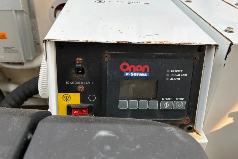 Slide: The Image of Onan e-Series generator control panel on a 2007 Tiara 3900 Sovran boat. - 67