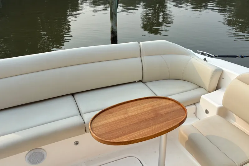 Slide: The Image of Luxurious seating area on a 2007 Tiara 3900 Sovran yacht with wooden table. - 24