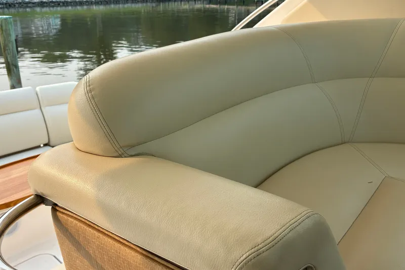 Slide: The Image of Luxurious beige seating on a 2007 Tiara 3900 Sovran yacht by the water. - 29