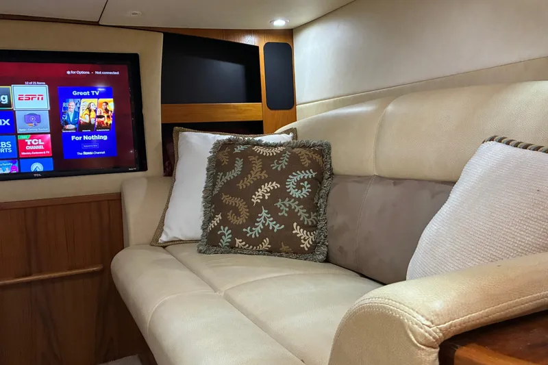Slide: The Image of Luxurious interior of 2007 Tiara 3900 Sovran yacht with plush seating and TV. - 50