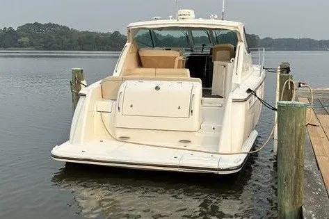 Slide: The Image of 2007 Tiara 3900 Sovran yacht docked on calm water. - 19