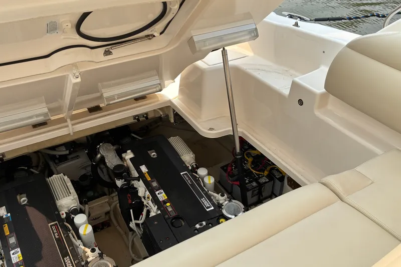 Slide: The Image of Engine compartment of a 2007 Tiara 3900 Sovran yacht, showcasing dual engines and battery setup. - 61
