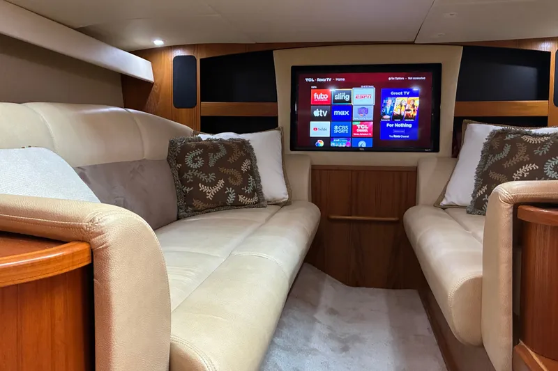 Slide: The Image of Luxurious interior of 2007 Tiara 3900 Sovran yacht with plush seating and modern entertainment system. - 49