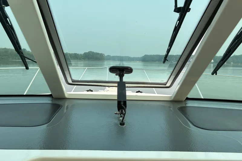Slide: The Image of View from the helm of a 2007 Tiara 3900 Sovran yacht, overlooking calm waters. - 40