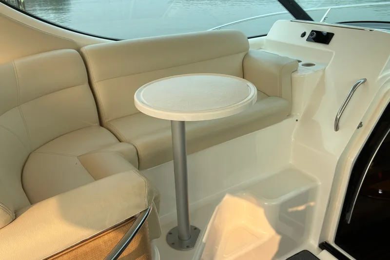 Slide: The Image of Luxurious interior seating of 2007 Tiara 3900 Sovran yacht with round table. - 26