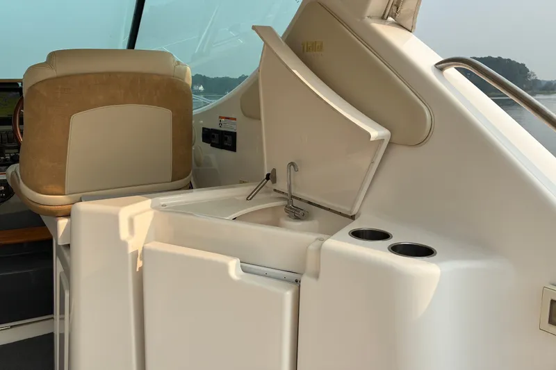 Slide: The Image of Interior of 2007 Tiara 3900 Sovran yacht featuring a compact sink and seating area. - 31