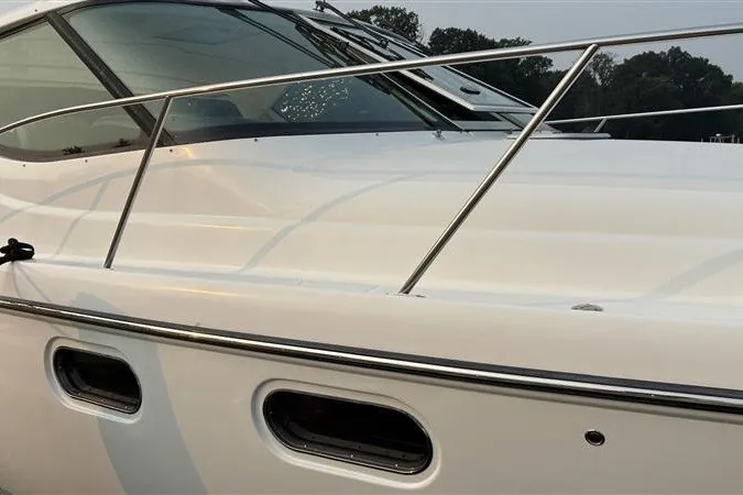 Slide: The Image of 2007 Tiara 3900 Sovran yacht, sleek white exterior with stainless steel railings. - 10
