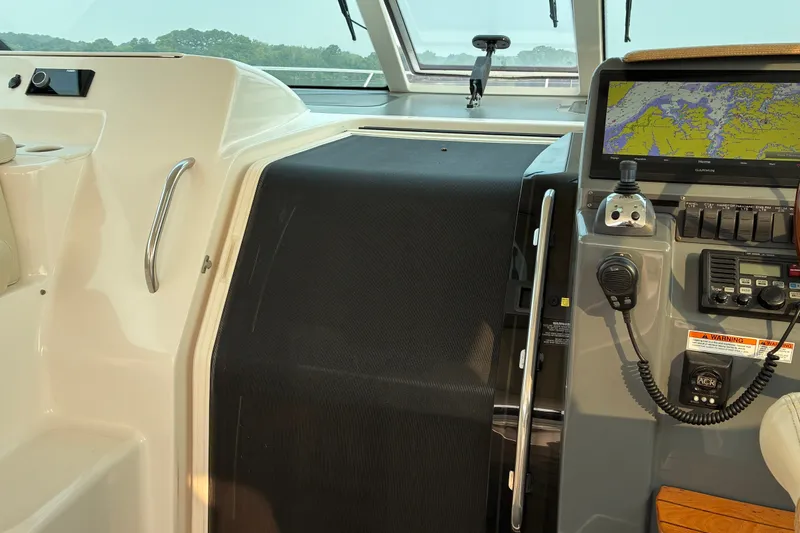 Slide: The Image of 2007 Tiara 3900 Sovran yacht cockpit with navigation equipment and control panel. - 41