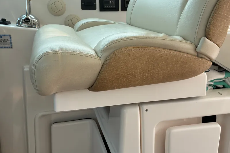 Slide: The Image of Captain's chair on 2007 Tiara 3900 Sovran yacht, featuring beige leather upholstery. - 39