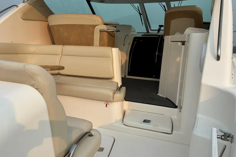 Slide: The Image of Interior of a 2007 Tiara 3900 Sovran yacht with beige seating and modern design. - 21
