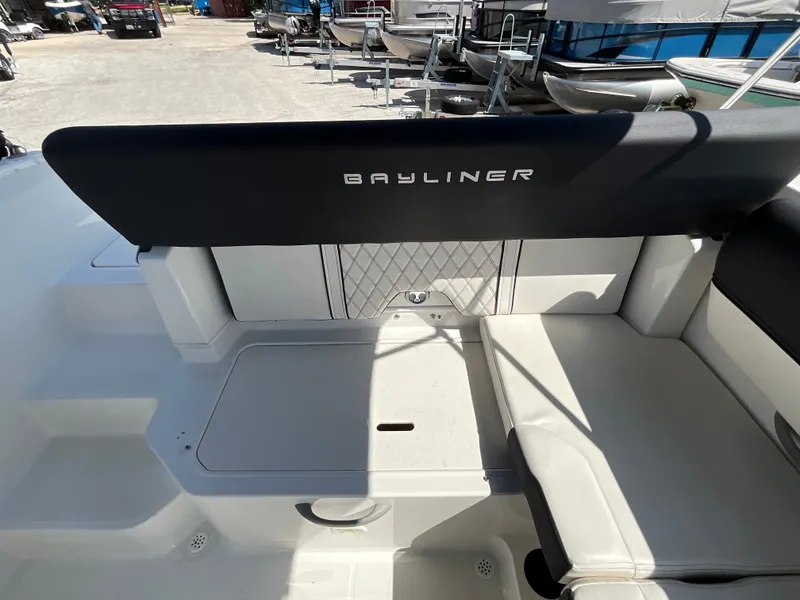 Slide: The Image of The image shows the interior of a 2021 Bayliner DX 2050 with white upholstery. - 10