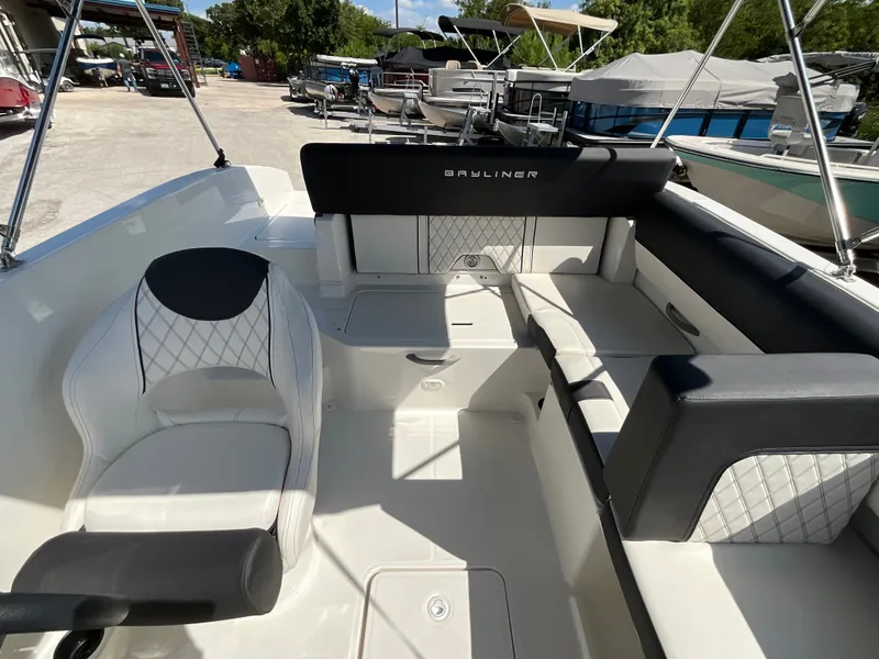 Slide: The Image of The image shows the cockpit of a 2021 Bayliner DX 2050 with sleek seating. - 8