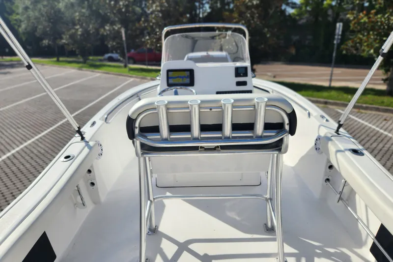 Slide: The Image of 2023 Tidewater 196 CC Adventure boat interior with rod holders and console view. - 43