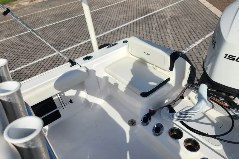 Slide: The Image of 2023 Tidewater 196 CC Adventure boat interior with seating and Honda 150 engine. - 44