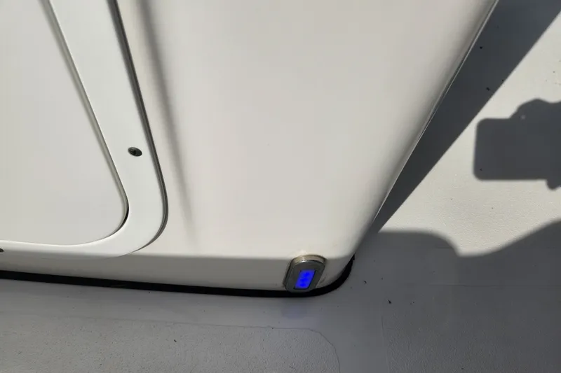 Slide: The Image of Close-up of 2023 Tidewater 196 CC Adventure boat interior detail with blue LED light. - 53