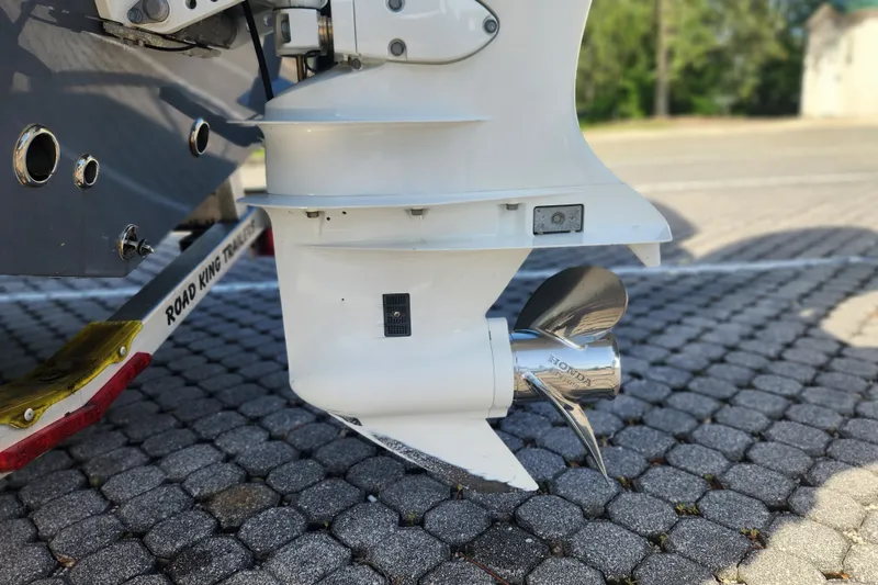 Slide: The Image of 2023 Tidewater 196 CC Adventure boat with Honda outboard motor on a Road King trailer. - 19