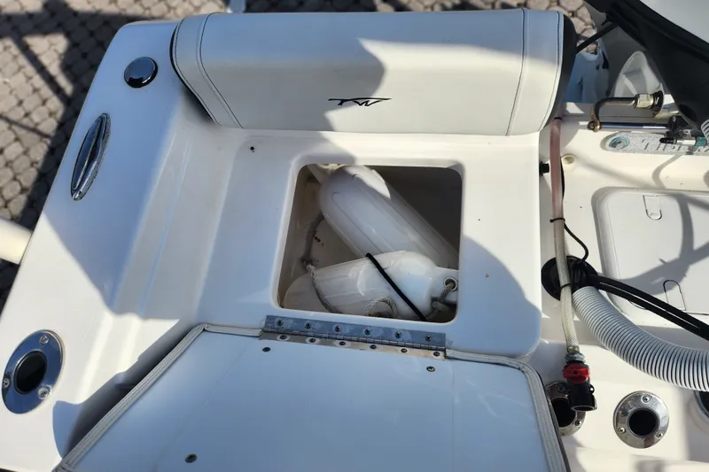 Slide: The Image of 2023 Tidewater 196 CC Adventure boat storage compartment with fenders and accessories. - 48