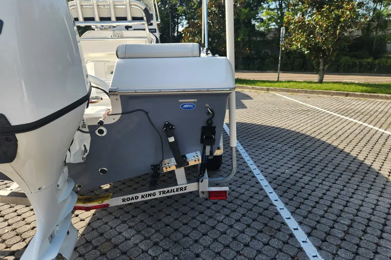 Slide: The Image of 2023 Tidewater 196 CC Adventure boat on Road King trailer in parking lot. - 16
