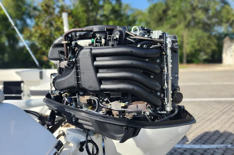 Slide: The Image of 2023 Tidewater 196 CC Adventure boat engine, detailed view with outdoor background. - 25