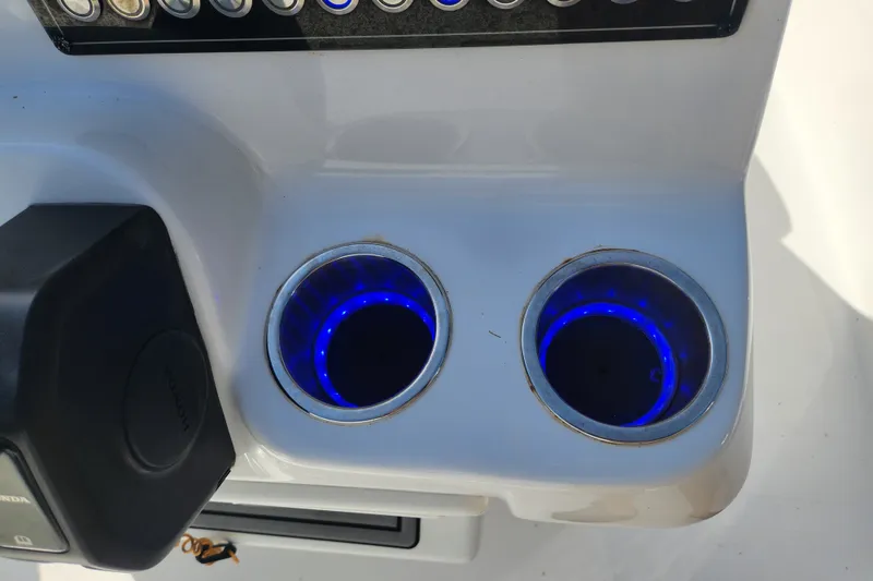 Slide: The Image of 2023 Tidewater 196 CC Adventure boat console with illuminated cup holders. - 54