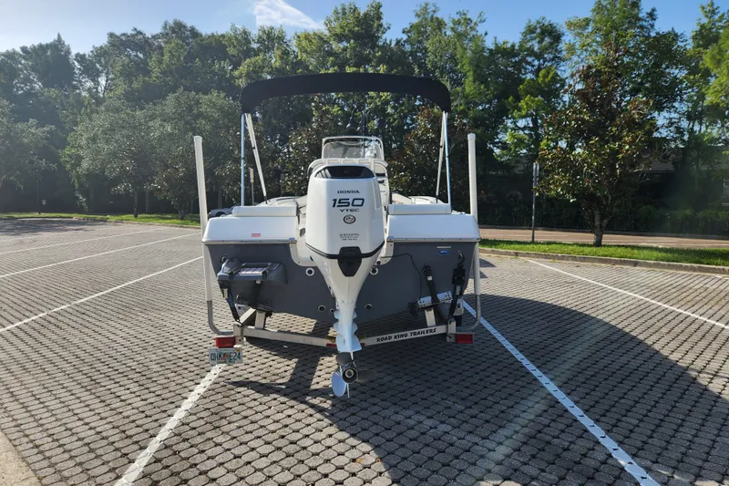Slide: The Image of 2023 Tidewater 196 CC Adventure boat with Honda 150 VTEC engine in parking lot. - 11