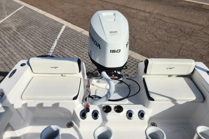 Slide: The Image of 2023 Tidewater 196 CC Adventure boat with Honda 150 engine, featuring seating and rod holders. - 42