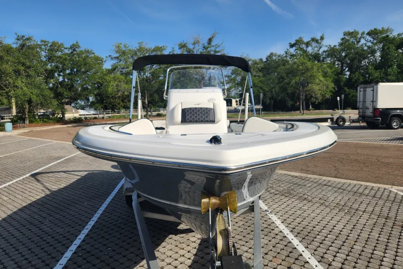 Slide: The Image of 2023 Tidewater 196 CC Adventure boat on trailer in sunny parking lot. - 4