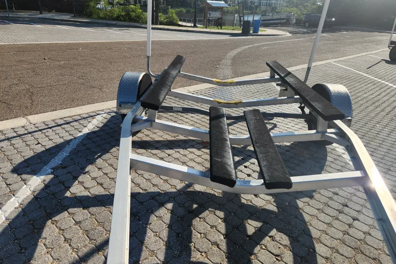 Slide: The Image of Boat trailer for 2023 Tidewater 196 CC Adventure on paved surface. - 64