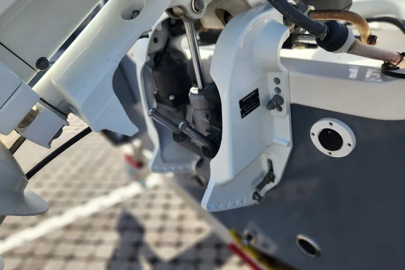 Slide: The Image of Close-up of 2023 Tidewater 196 CC Adventure boat engine components. - 24