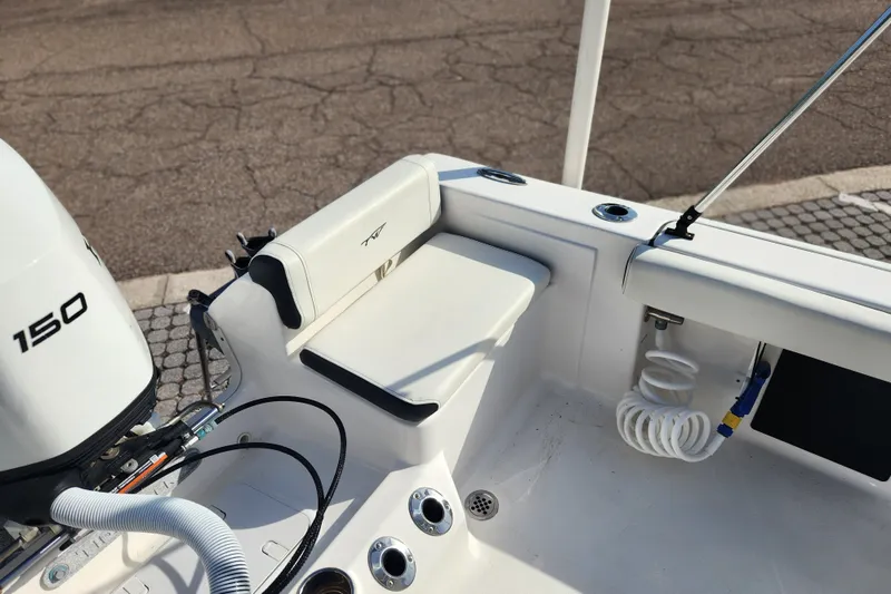 Slide: The Image of 2023 Tidewater 196 CC Adventure boat interior with seating and motor details. - 45