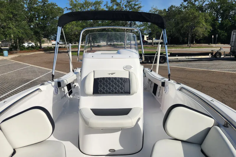 Slide: The Image of 2023 Tidewater 196 CC Adventure boat interior with seating and canopy. - 32