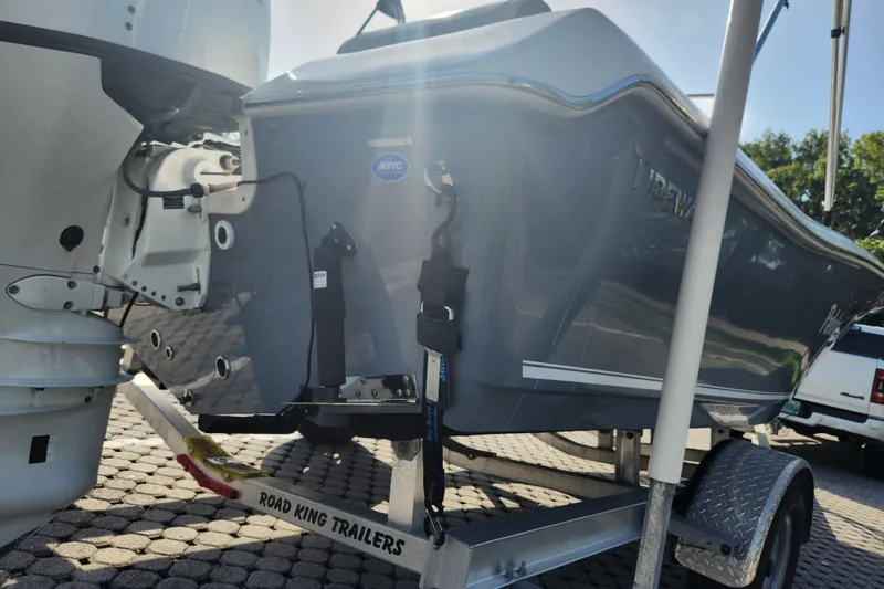 Slide: The Image of 2023 Tidewater 196 CC Adventure boat on Road King trailer, rear view. - 18