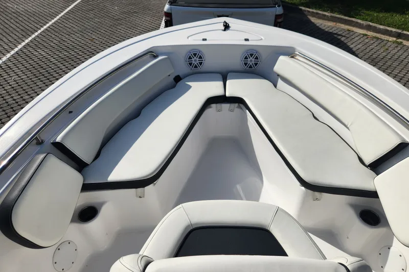 Slide: The Image of 2023 Tidewater 196 CC Adventure boat interior with cushioned seating and speakers. - 29