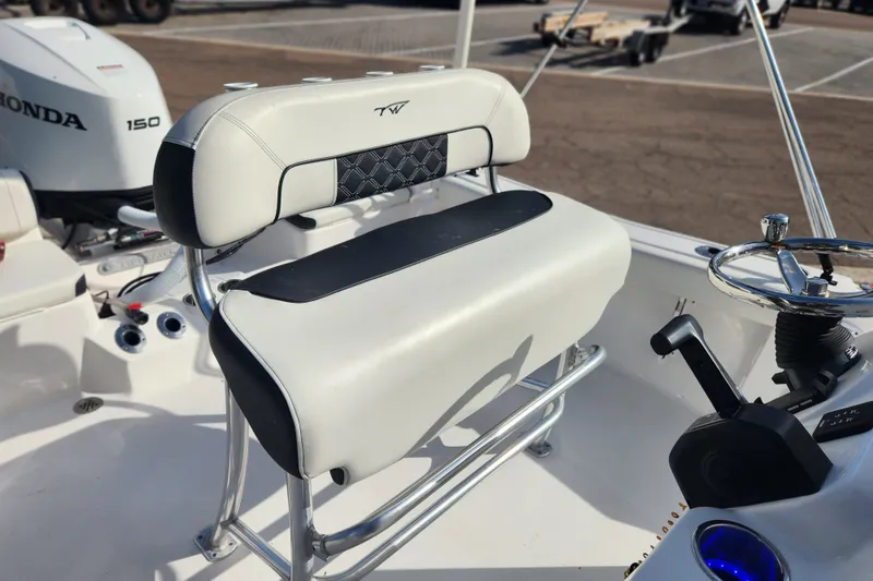 Slide: The Image of 2023 Tidewater 196 CC Adventure boat interior with Honda 150 engine and steering console. - 39