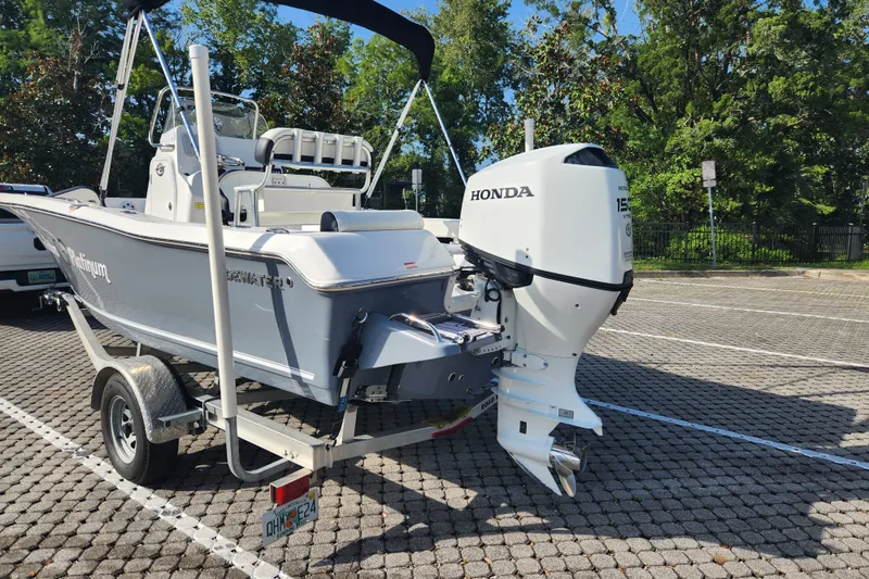 Slide: The Image of 2023 Tidewater 196 CC Adventure boat with Honda outboard motor on a trailer. - 9