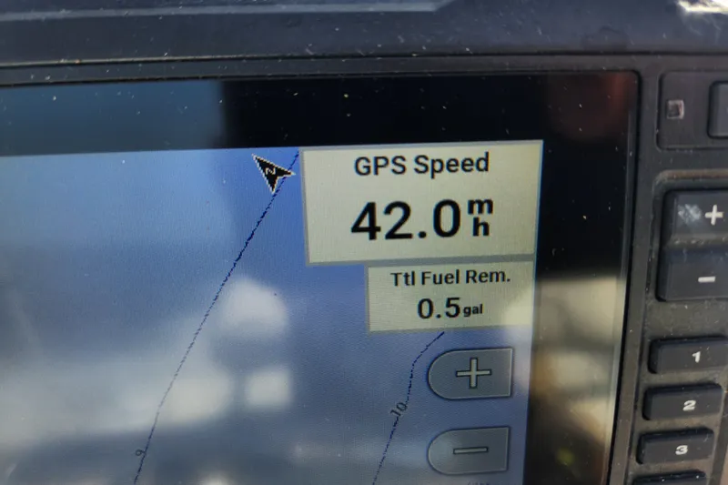 Slide: The Image of GPS display showing speed of 42 mph and 0.5 gallons fuel remaining on 2023 Tidewater 196 CC Adventure. - 60