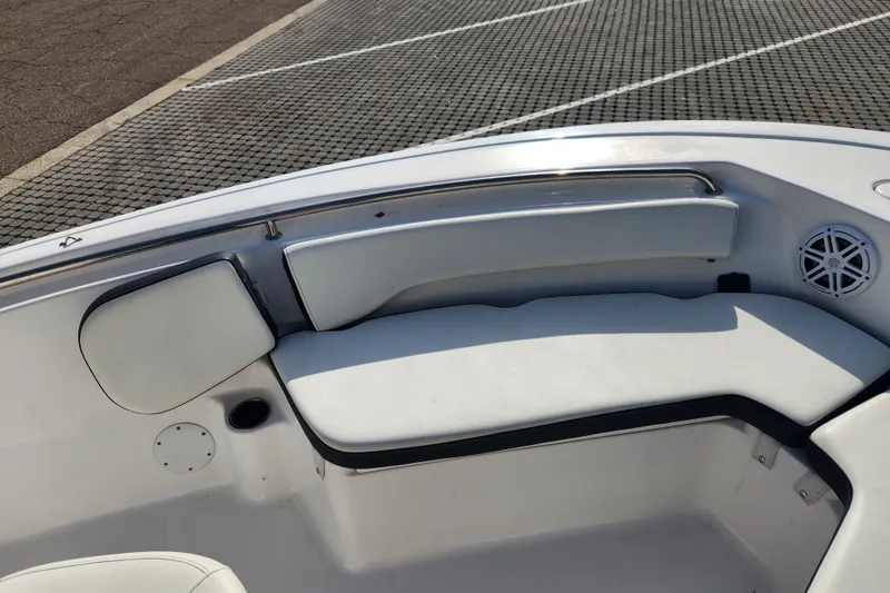 Slide: The Image of 2023 Tidewater 196 CC Adventure boat interior with cushioned seating and speaker. - 31