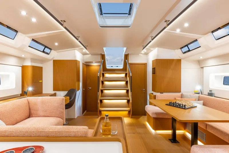 Slide: The Image of Manufacturer Provided Image: Luxurious interior of 2026 Beneteau First 60 yacht with modern furnishings and chess set. - 3
