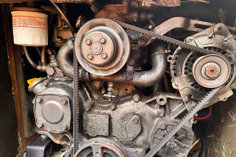 Slide: The Image of Close-up of a 1989 CAL 39 engine with visible belts and components. - 14