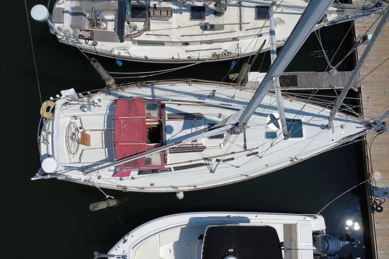 Slide: The Image of Overhead view of a 1989 CAL 39 sailboat docked at a marina. - 8