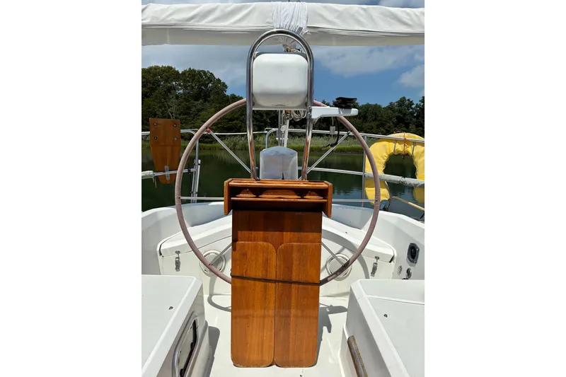 Slide: The Image of Cockpit of a 1989 CAL 39 sailboat with wooden helm and steering wheel. - 5