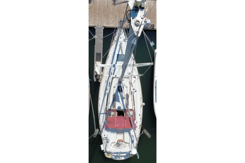 Slide: The Image of Aerial view of a 1989 CAL 39 sailboat docked at a marina. - 2