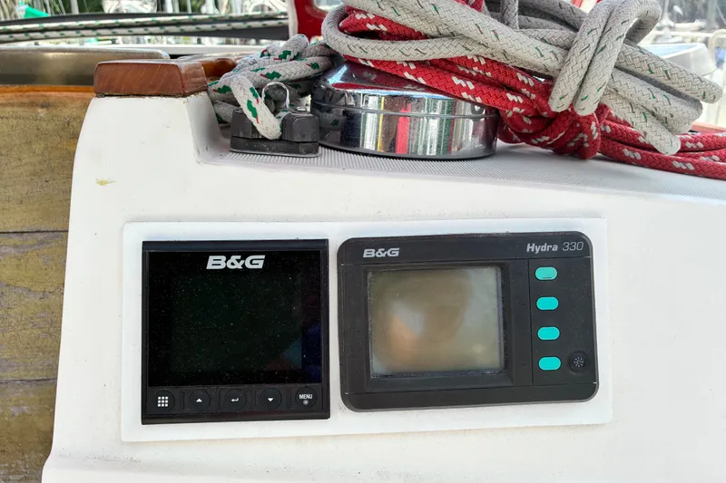 Slide: The Image of B&G navigation instruments on a 1989 CAL 39 sailboat with coiled ropes. - 30