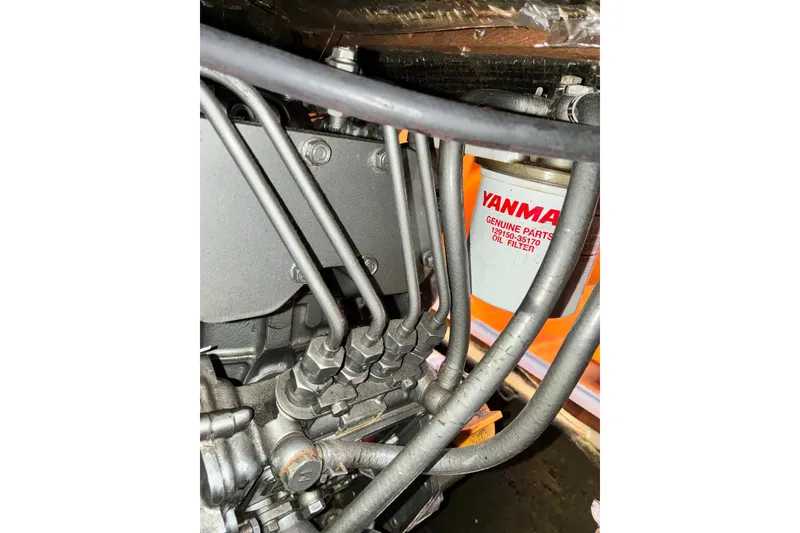 Slide: The Image of Close-up of a Yanmar oil filter and engine components in a 1989 CAL 39. - 41
