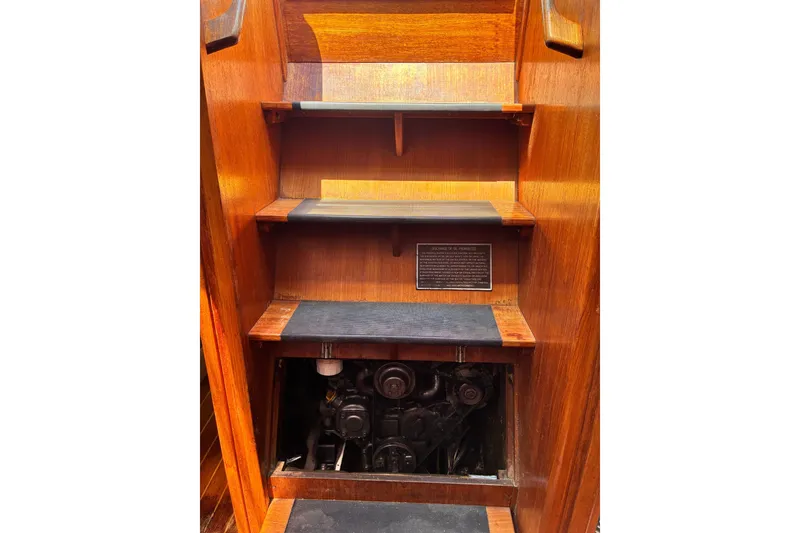 Slide: The Image of Wooden interior stairs with engine compartment in 1989 CAL 39 sailboat. - 22