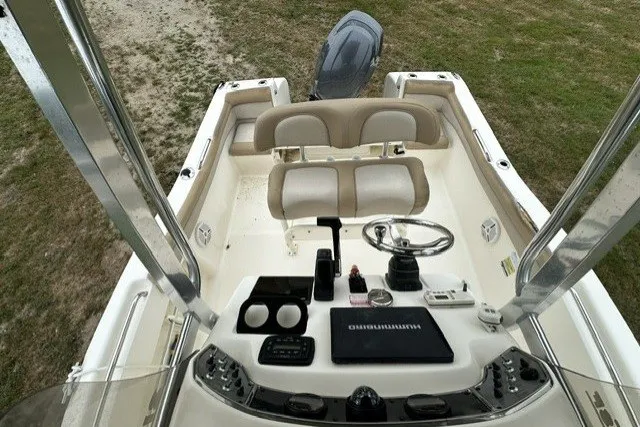 Slide: The Image of 2012 Scout 210 XSF boat interior with steering wheel and seating. - 7