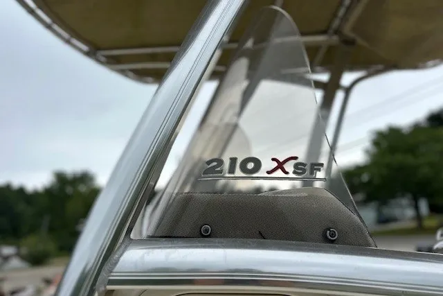 Slide: The Image of 2012 Scout 210 XSF boat windshield with logo, showcasing sleek design and craftsmanship. - 5